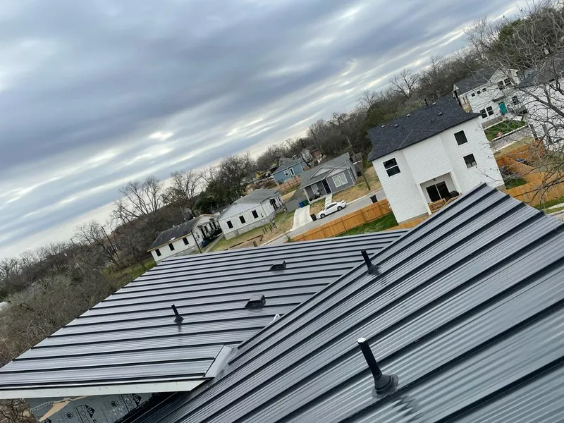 Standing seam metal roof panels with vents for Skylight Repair in Versailles
